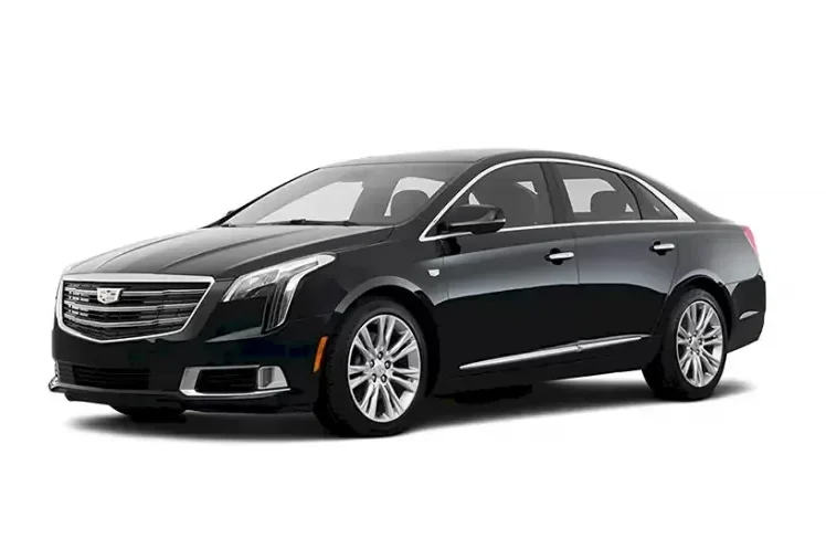 A black Cadillac XTS luxury sedan used for executive airport transfers and point-to-point transportation services in St. Louis and Chesterfield.