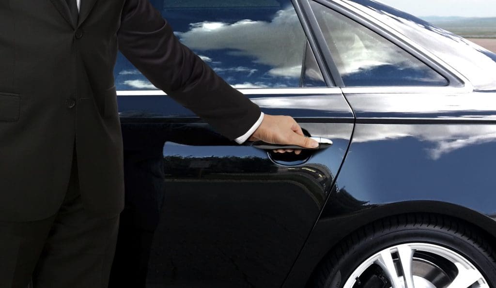 The Ultimate Guide to Hiring an Affordable Airport Limo in St. Louis. 1 Airport Limo in St. Louis driver holding the door for the passenger